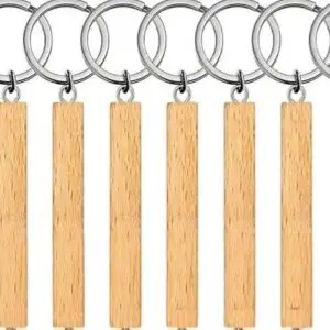 Wooden keychains with metal rings arranged in a row.