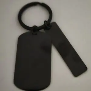 Black metal keychain with two attached tags on a ring.