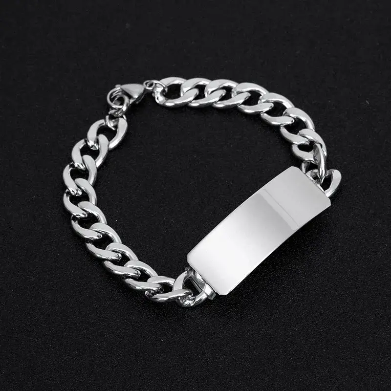Silver chain bracelet with a blank rectangular plate.
