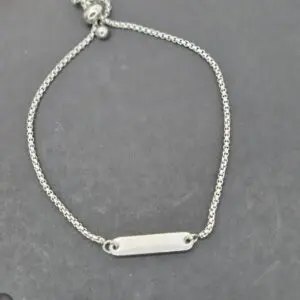 Elegant silver bracelet with a sleek bar charm.