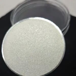Close-up of a round, textured silver container lid.