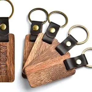 Wooden keychains with leather straps and brass rings.