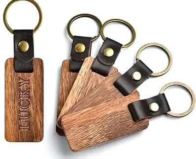 Wooden keychains with leather straps and brass rings.