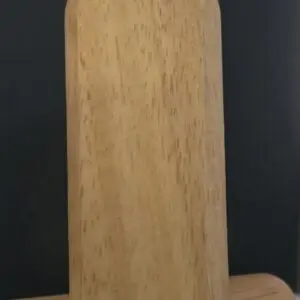 A simple rectangular wooden cutting board with rounded edges.