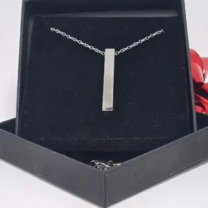 Elegant silver pendant necklace in a black gift box.