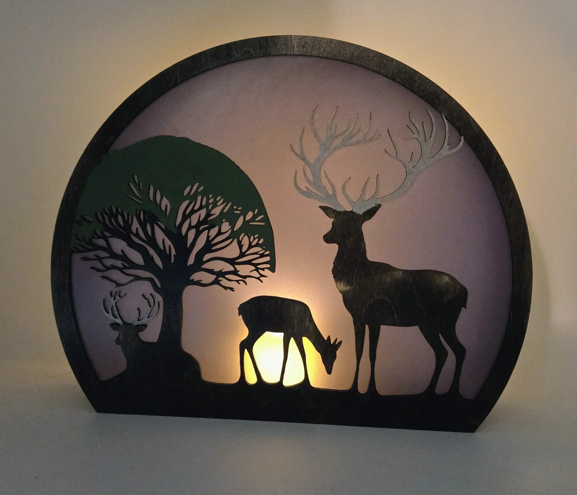 Backlit deer silhouette lamp with tree