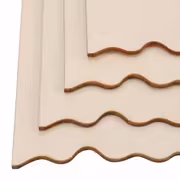 Stacked beige molding pieces with decorative wavy edges.